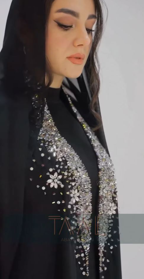 Close-up of a black beaded and crystal-embellished abaya