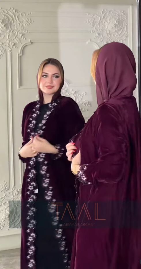Maroon velvet abaya with floral embroidery, worn by two models
